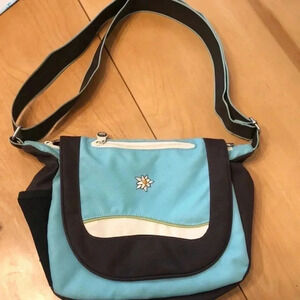 Sherpani blue, white, brown crossbody bag.  Measures 10 x 10.